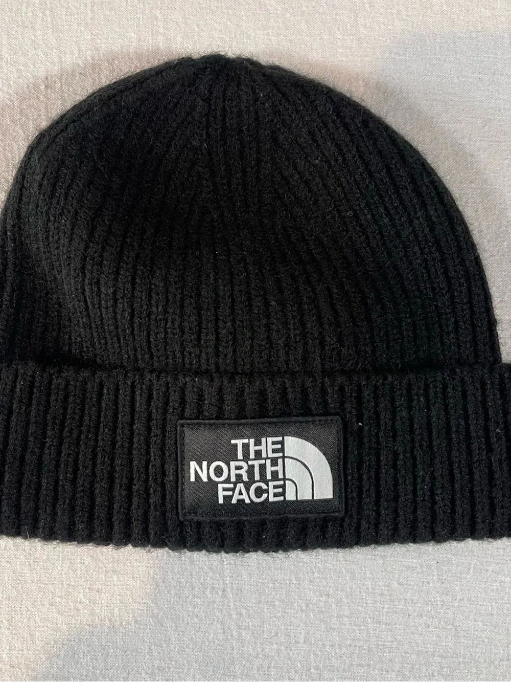 The North Face Black Ribbed Cuffed Beanie with Logo Patch